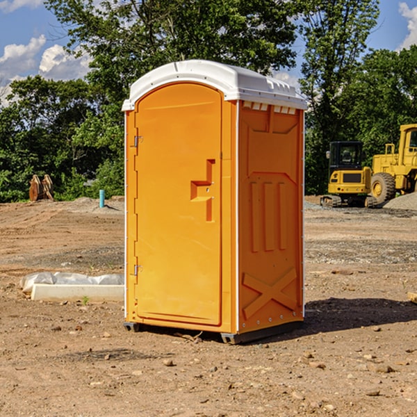 what is the cost difference between standard and deluxe portable restroom rentals in Benton